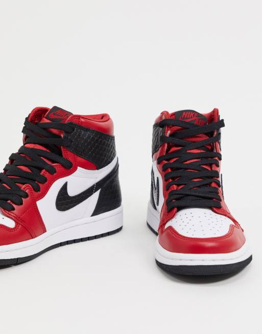 Jordan Air 1 High OG Sneakers rosse e nere pitonate