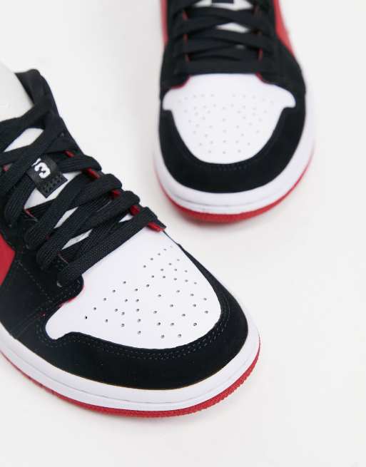 Jordan Air 1 Low trainers in red black and white