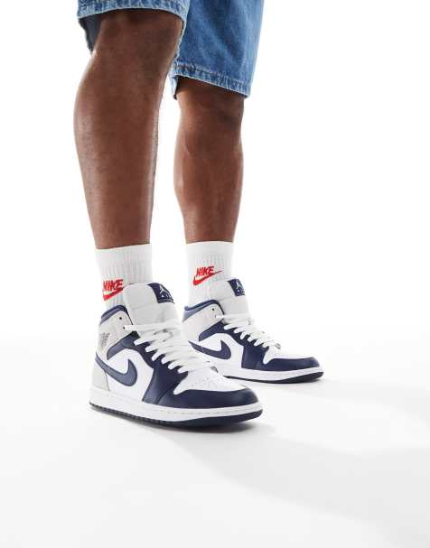 Jordan Air 1 mid trainers in white and navy - view 1