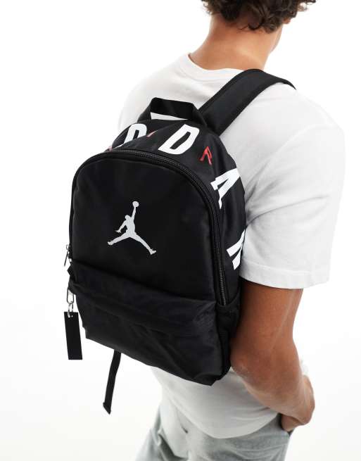 jordan air mini backpack in black Nike (10L) -Black/Red and ready for school or everyday carry Nike Jordan Flight Mini Backpack