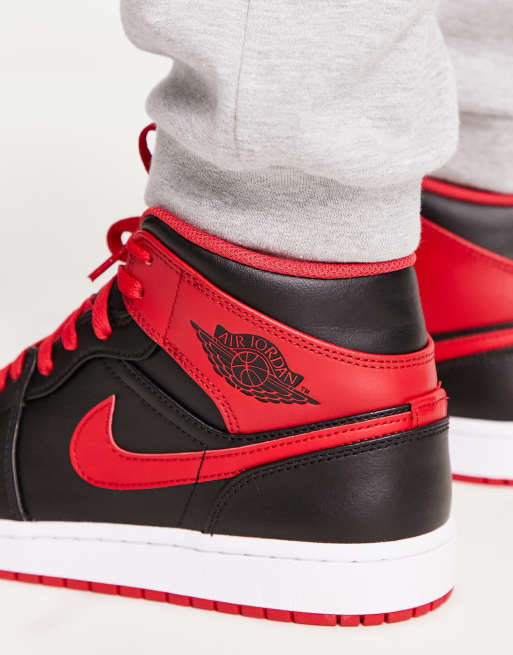 Nike air jordan 1 mid trainers in black and red best sale