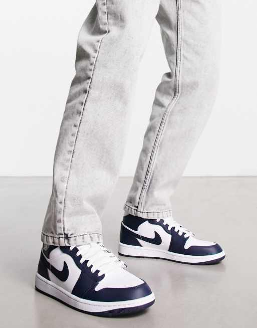 Jordan AJ 1 Mid trainers in navy and white