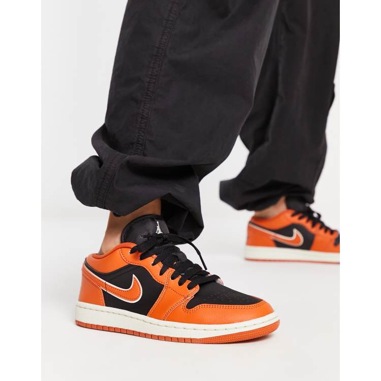 Orange low top store jordans