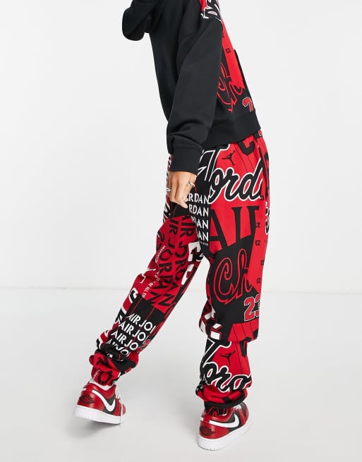 Jordan basketball all over print joggers in black and gym red