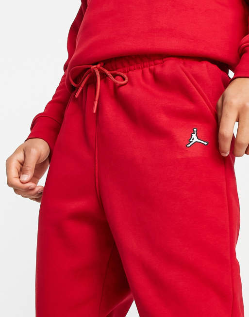 NIKE AIR JORDAN ESSENTIALS FLEECE PANTS GYM RED