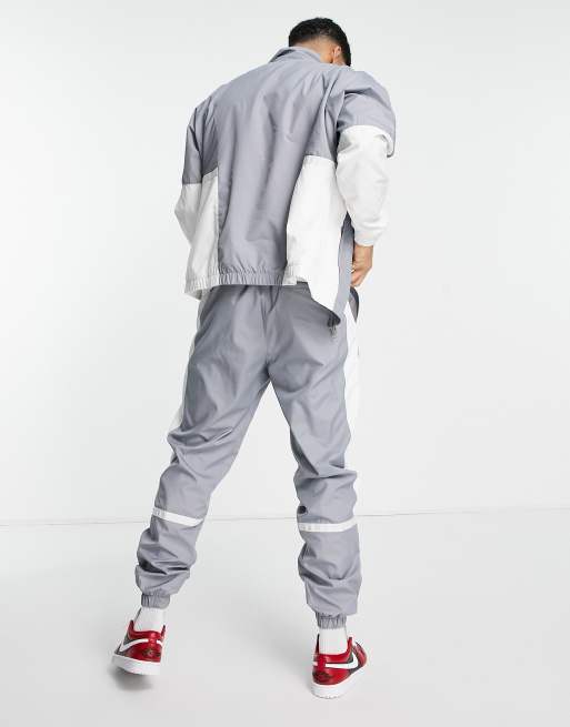 Jordan Paris Saint-Germain Pantalon de jogging tissé Gris et