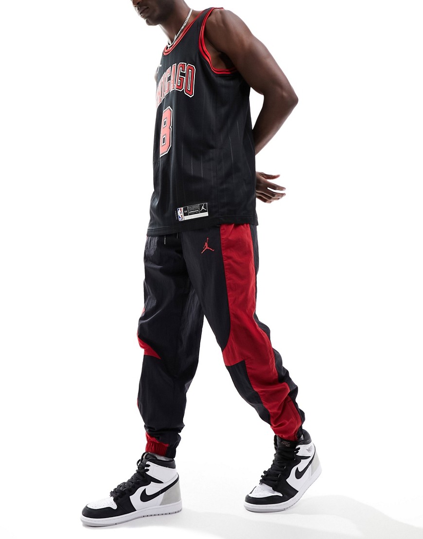 Jordan tracksuit joggers in balck and gym red
