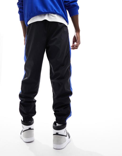 Jordan tracksuit joggers in black and royal blue ASOS