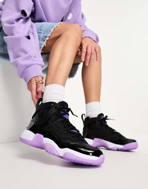 Black jordans hotsell with purple logo