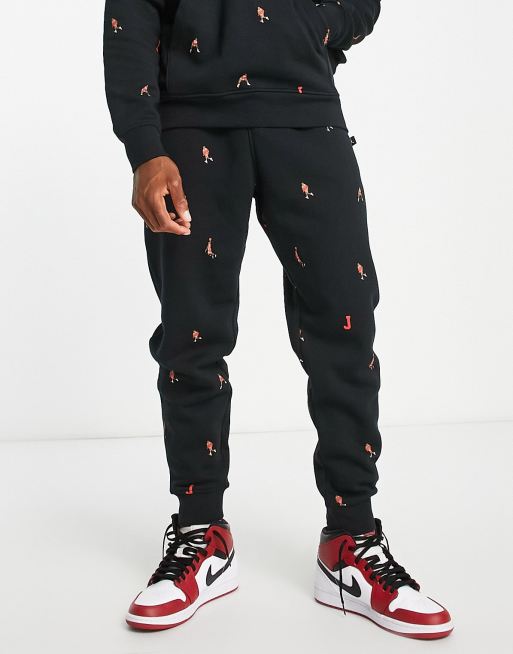 Jordan Unisex Essential – Czarne joggersy we wzór z logo na całej powierzchni