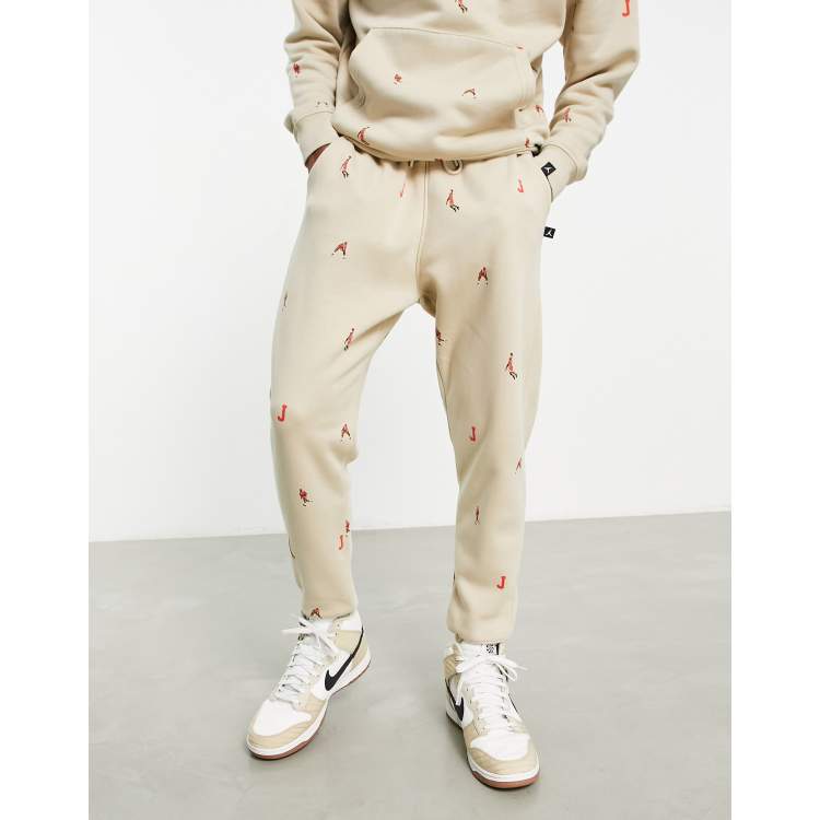 Jordan unisex essential joggers with all over logo in rattan