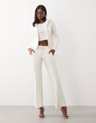 Pantalon de jogging ample d'ensemble en velours à taille basse et logo à strass - Crème-Blanc XS