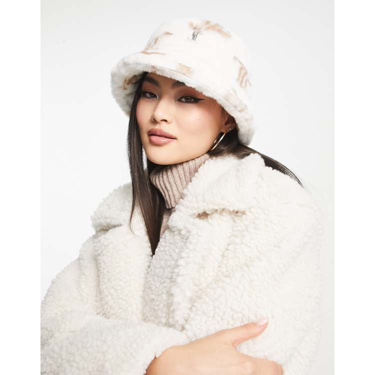 Juicy Couture printed monogram faux fur bucket hat in cream | ASOS