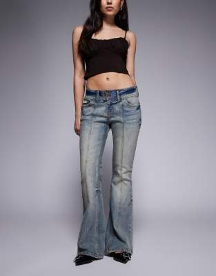 Juicy Couture - Schlagjeans in blauer Vintage-Waschung mit Strass-Logo