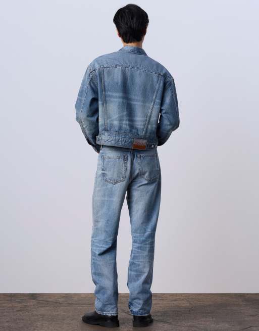 Jung Kook for Calvin Klein 90s straight leg jeans with rips in