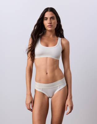 Jung Kook for   Tシャツブラレット Jung Kook for Calvin Klein bralette in off-white | ASOS