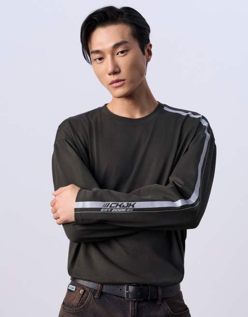 Jung Kook for Calvin Klein racing badge graphic long sleeve top in