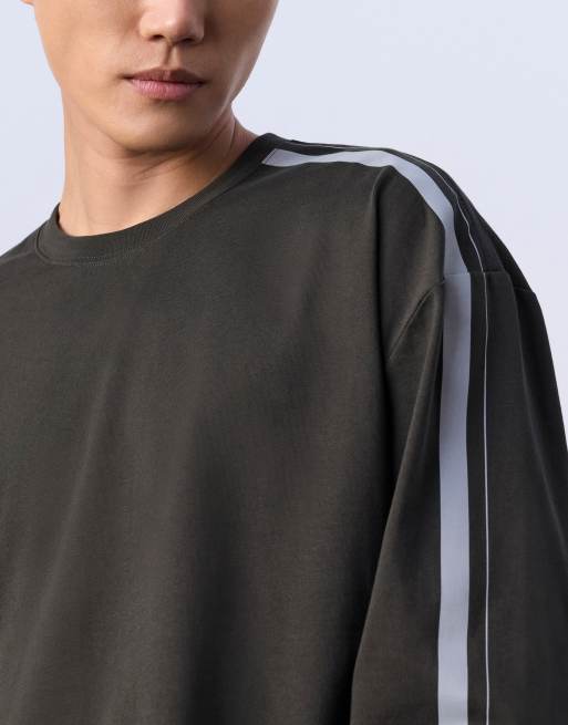 Jung Kook for Calvin Klein racing badge graphic long sleeve top in