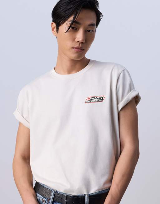 Jung Kook for Calvin Klein racing badge graphic T-shirt in off