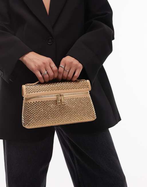 JW Thea – Ljust guldfärgad handväska med utsmyckning och handtag upptill