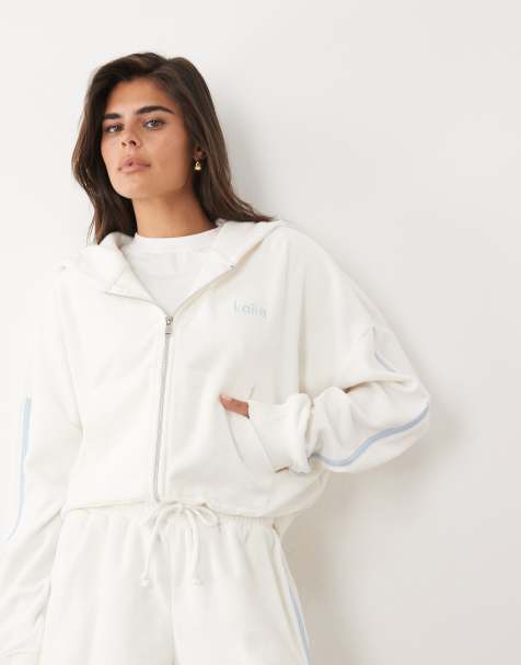 Kaiia – Biała bluza oversize z kapturem zapinana na zamek z materiału frotté z dużą zawartością bawełny z niebieskimi lampasami i haftowanym logo, część zestawu - view 1