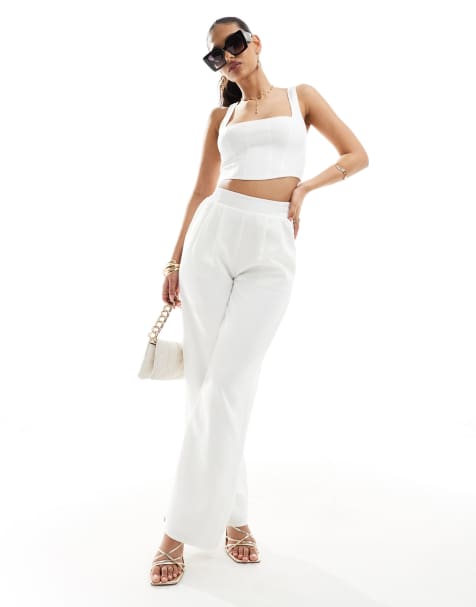 Kaiia – Biały elegancki zestaw: krótki top z kwadratowym dekoltem i spodnie z szerokimi nogawkami i gumką w pasie - view 1