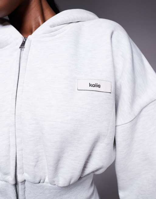 Kaiia cinched waistband dropped shoulders zip up hoodie in