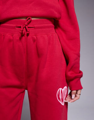 Kaiia Contrast Heart Logo Wide Leg Deep Waistband Sweatpants In Red