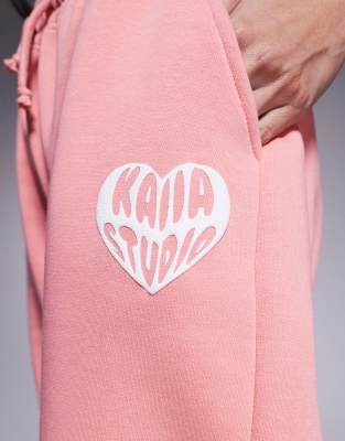 Shop Kaiia Contrast Heart Logo Wide Leg Sweatpants In Orange