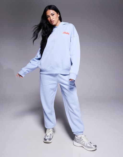 Kaiia - Coordinato azzurro e rosso con joggers con polsino, felpa con cappuccio oversize e t-shirt baby corta con logo in rilievo