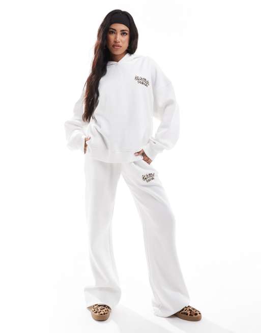 Kaiia - Coordinato color crema composto da joggers a fondo ampio e felpa oversize con cappuccio e stampa leopardata sul retro
