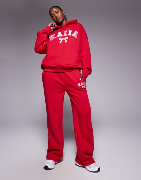 Kaiia - Coordinato rosa e rosso composto da joggers a fondo ampio e felpa oversize con cappuccio e logo con fiocco ricamato - view 1
