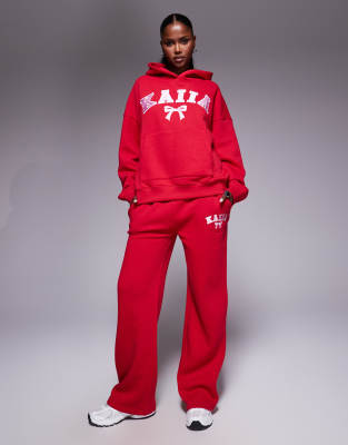 Kaiia cotton blend embroidered bow logo wide leg sweatpants in red and pink - part of a set