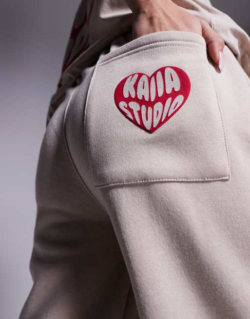 Kaiia cotton blend heart back pocket logo sweatpants in stone and