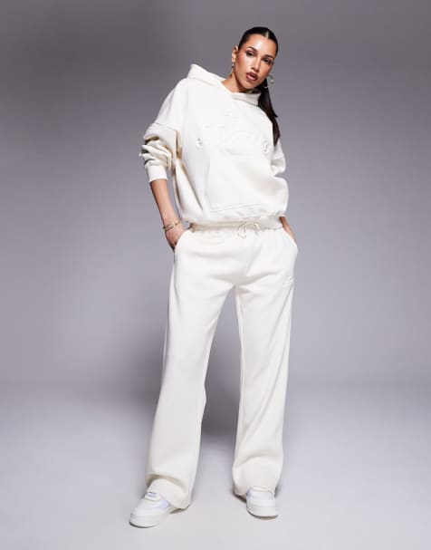 Kaiia cotton rich embossed script logo sweatpants in buttercream - part of a set - view 1