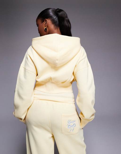 Kaiia cotton rich embroidered bow logo cropped zip through hoodie co-ord in lemon and blue, 3 of 4