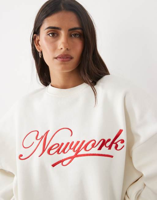 Kaiia cotton rich embroidered New York script logo oversized hoodie and sweatpants in cream and red, 2 of 3