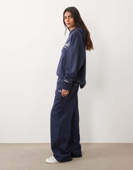 Kaiia cotton rich embroidered New York script logo wide leg joggers co-ord in navy, 2 of 5