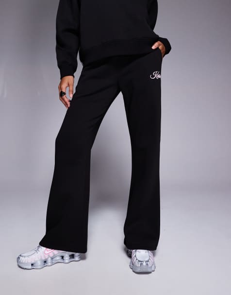 Kaiia – Czarne joggersy z dużą zawartością bawełny z szerokimi nogawkami i jasnoróżowym napisem z logo, część zestawu - view 1