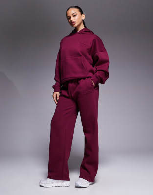 Kaiia Embossed Logo Wide Leg Sweatpants In Red