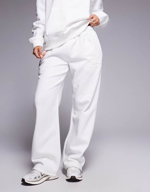 Kaiia embossed logo wide leg sweatpants in white - part of a