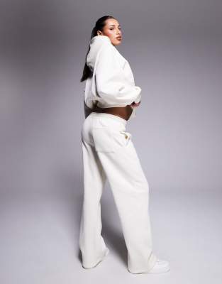 Kaiia Embossed Script Logo Sweatpants In White