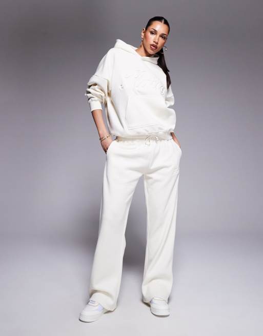 Kaiia embossed script logo trackies in buttercream (part of a set)