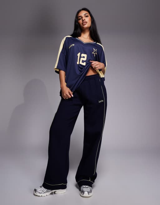 Kaiia cotton rich embroidered logo contrast piping funnel neck zip sweatshirt and trackies set in navy and yellow, 2 of 3