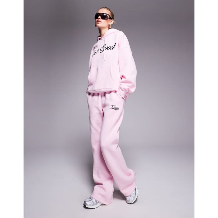 Kaiia embroidered script logo sweatpants in pink and black