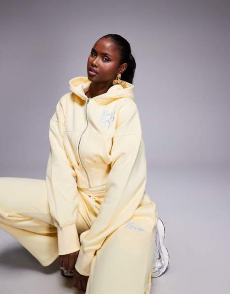 Kaiia - Ensemble en coton majoritaire à broderie logo et nœud avec pantalon de jogging ample, sweat à capuche zippé et crop top à encolure dégagée - Jaune citron/bleu - view 1