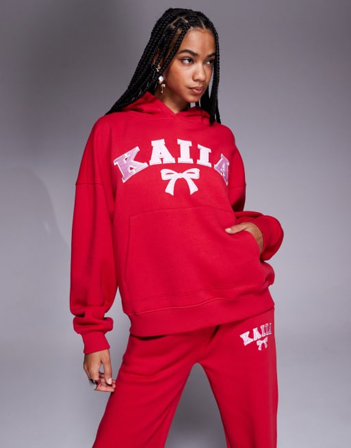 Kaiia - Ensemble sweat à capuche oversize à logo nœud brodé et pantalon de jogging large - Rose et rouge
