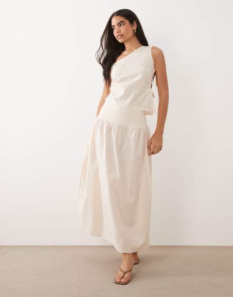 Kaiia Exclusive – Beżowy zestaw z mieszanki lnu: spódnica i asymetryczny top z odkrytym ramieniem i otwartym bokiem z wiązaniem - view 1