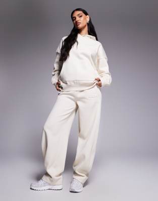 Kaiia Exclusive Bubble Embossed Logo Barrel Leg Sweatpants In Neutral