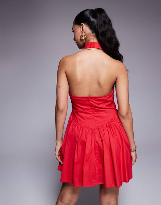 Kaiia exclusive cotton rich halterneck low back dropped v waist mini dress in red